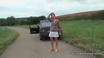 Young Girl Entices Elderly Man During Outdoor Encounter