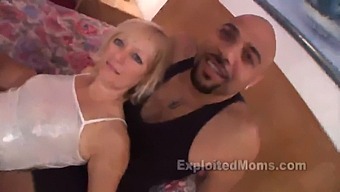 A Mature Blonde Woman Engages In Sexual Activity With An Inexperienced Partner Who Possesses A Large Black Penis, As Depicted In A Steamy Video